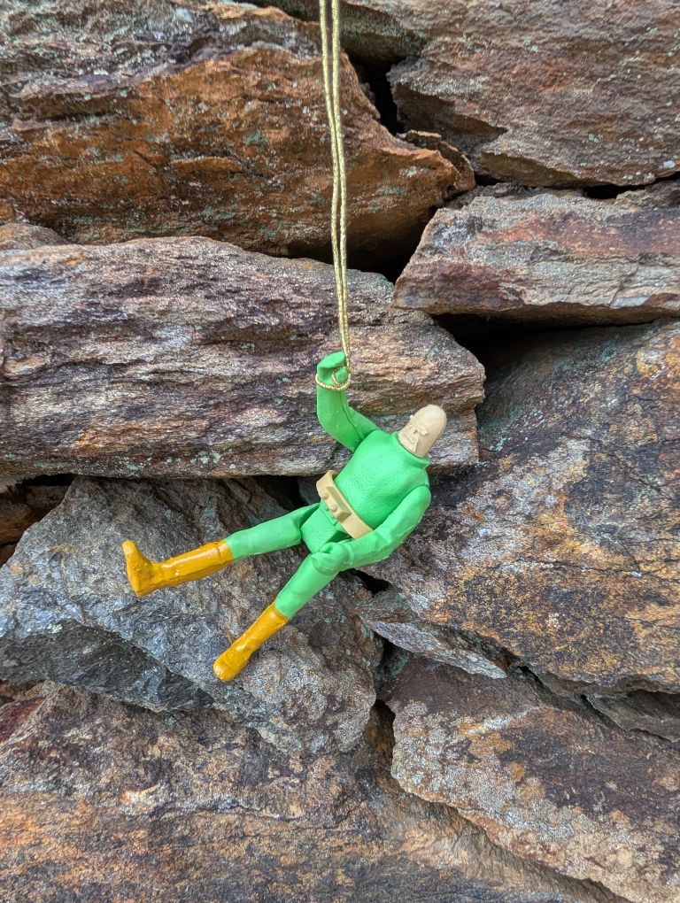 Space Hawk Hanging from his Grappling hook