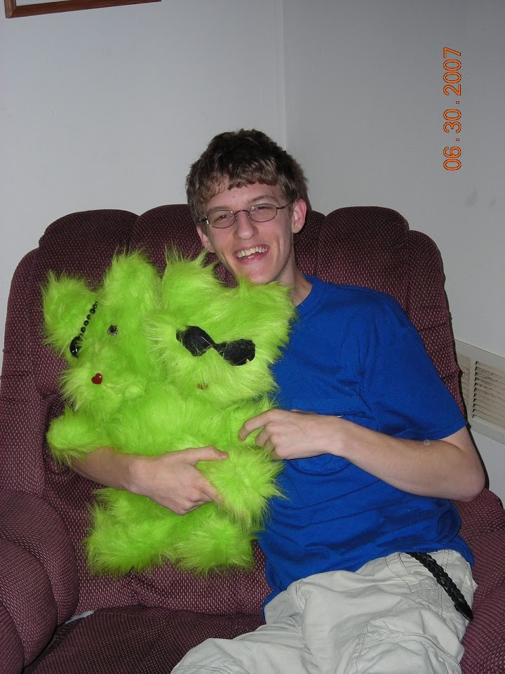 Me, holding a green bear with two heads and three arms